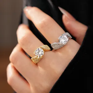 Elegant gold and silver twisted open rings featuring a brilliant round center zircon