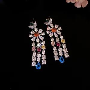 Detailed view of colorful zircon flower tassel earrings with sparkling teardrop crystals