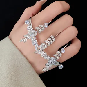Close-up of zircon wheat ear ring showing sparkling marquise-cut stones on hand