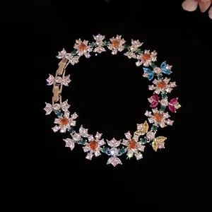 Detail of a sparkling colorful zircon flower bracelet displayed on a black background