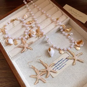 Luxus Legierung Künstliche Perle Seestern Muschel Halskette Für Damen Urlaubsstil Vergoldeter Marine Schmuck
