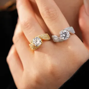 Close-up detail of luxurious twisted round zircon rings with pavé stones on a hand