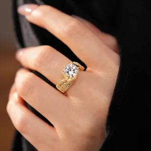 Close-up of a gold-plated twisted ring with a sparkling large round zircon stone.
