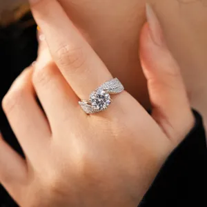 Elegant silver-toned twisted open ring with a large round zircon and sparkling pavé setting