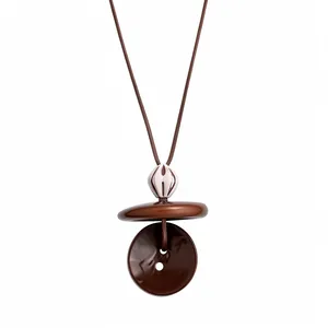 Vintage ethnic style long necklace with round resin and wood bead pendant in earthy brown