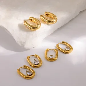 Luxury gold plated U-shaped stainless steel hoop earrings with sparkling zirconia accents.