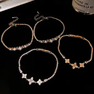 Elegant set of 18k gold plated flower and pearl bracelets with sparkling cubic zirconia