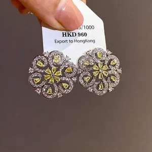 Elegant French style hollow flower stud earrings with yellow and clear sparkling crystals
