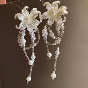 Elegant pearl flower tassel earrings with silver needles and translucent white petals.