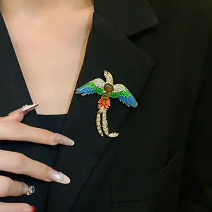 Close-up of a vintage enamel bird brooch with rhinestones on a black blazer lapel