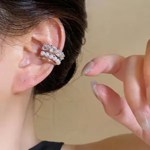 Elegant silver multi-layer ear cuff with sparkling zircons and pearls for a sophisticated look