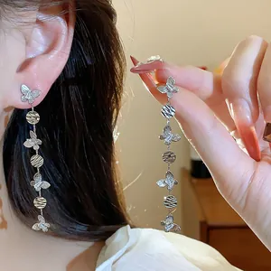 Elegant butterfly tassel earrings with 18k gold plating and shimmering zircon.