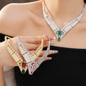 Detailed view of vintage royal style V-shaped necklaces with 18k gold plating and gems.