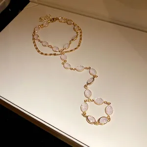 Vintage style golden double-layer hand chain bracelet with elegant pink oval resin inserts