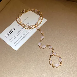 Vintage gold-tone double-layer bracelet with oval pink resin beads and elegant design