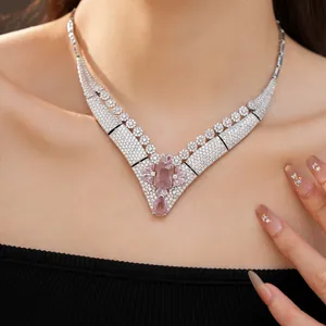Macro detail of vintage palace style 18k gold plated necklace with pink zirconia
