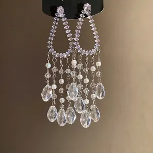 Elegant silver needle zircon tassel earrings with white pearls for a luxury jewelry look.
