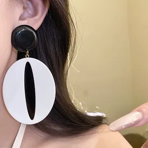 Detail view of high-quality vintage resin oval drop earrings in black and white finish