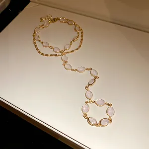 Close-up of vintage gold double-layer slave bracelet with elegant oval resin stones