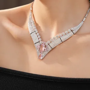 Detailed close-up view of vintage pink zirconia floral necklace on model showing craftsmanship