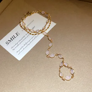 Elegant gold-tone double-layer bracelet with soft pink oval resin stones for women