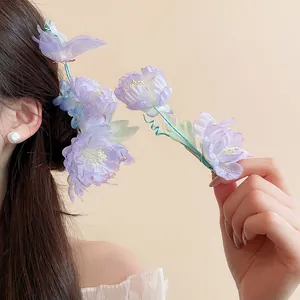 Detailed close-up of elegant purple fabric flower hairpins for Chinese style hair styling