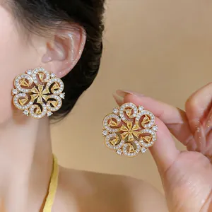 Detailed view of 18K gold-plated zircon flower earrings with intricate French court style