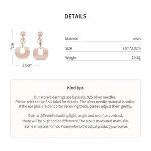 Detail view of pink resin drop earrings with 925 silver needles and dimensions