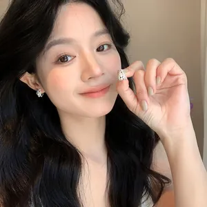 French style pearl hoop earrings worn by a model for a high-end luxury look