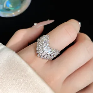 Close-up of a luxury starfish ring with baguette crystals on a finger.