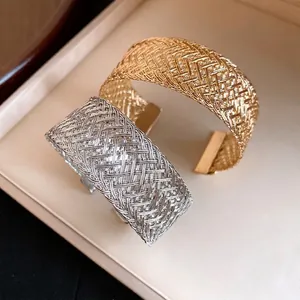 Elegant woven metal cuff bracelets in gold and silver tones with vintage style for women