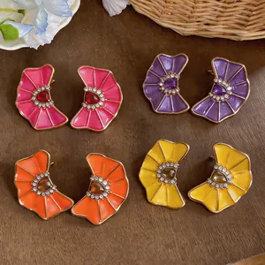 Vibrant pleated enamel flower earrings with rhinestones shown in multiple colors