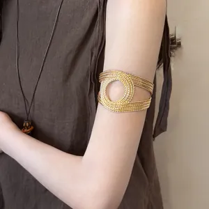 Minimalist layered gold spiral upper arm cuff with vintage bohemian style for women