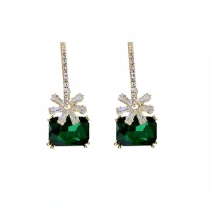 Elegant emerald green zircon flower drop earrings for women on white background
