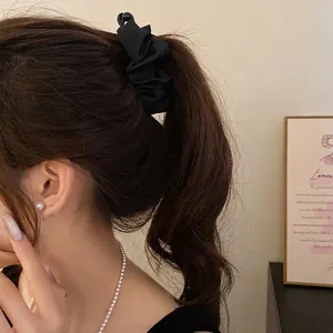 Elegant minimalist black pleated fabric banana hair clip for high ponytail styling