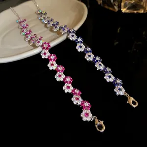 Elegant zircon flower bracelet with pink and blue stones in a luxurious design