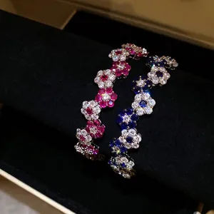 Elegant zircon flower bracelets in pink and blue for a chic, high-end look