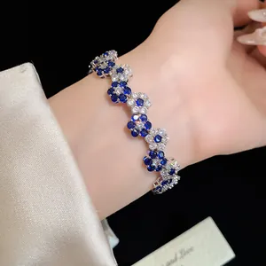 Detail shot of elegant zircon flower bracelet with sparkling blue and white stones