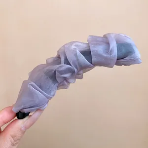 Close-up of elegant lavender pleated organza fabric banana hair clip for high ponytails