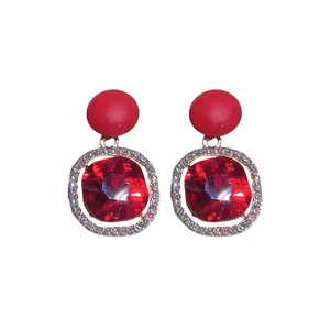 Elegant red crystal halo stud earrings featuring matte top sphere and gold-plated finish