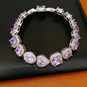 Luxury women's bracelet featuring purple heart and oval zircon stones on silver-tone base