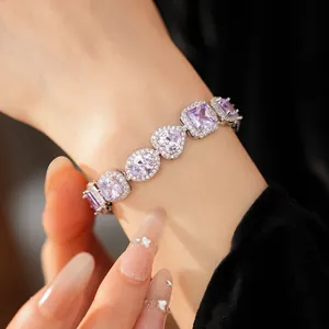 Detailed macro view of women's lavender zircon bracelet with heart and oval shaped stones