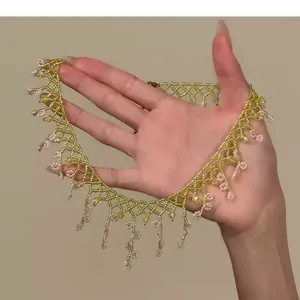 Detail view of a hand-woven glass bead necklace with delicate floral fringe design