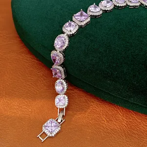 Exquisite detail of silver-toned bracelet featuring heart and oval purple zircons