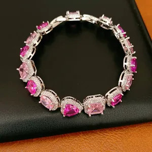 Close-up of luxury bracelet featuring pink and purple zircons in heart and oval shapes