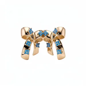 Elegant gold-plated bow stud earrings with delicate blue zircon floral accents
