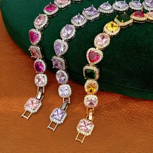 Close-up of zircon bracelets in silver and gold finish with colorful heart-shaped stones