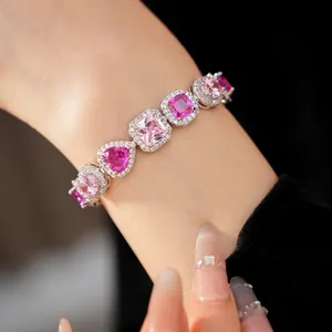 Detailed macro view of pink heart and square zircon stones on elegant silver bracelet