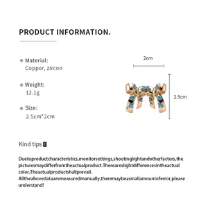 Detailed view of bow-shaped copper earring with blue zircon flowers and dimensions