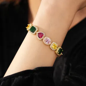 Detail view of multicolored zircon bracelet with heart-shaped stones on gold-plated base